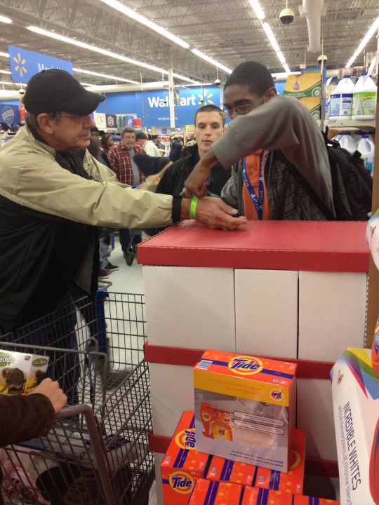 John Doe getting de-wristbanded and given a TV.